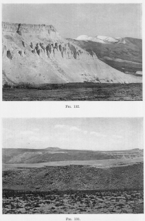 Fig. 132—Recessed volcanoes in the right background and
eroded tuffs, ash beds, and lava flows on the left. Maritime Cordillera
above Cotahuasi.