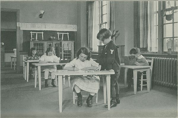 children sitting at tables in class