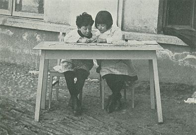 photograph--two children sitting at table