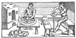Fig. 25.—Venetian Potters of the Sixteenth Century.
Showing two kinds of potter’s wheels in use among them. (From engraving
by V. Biringuccio.)