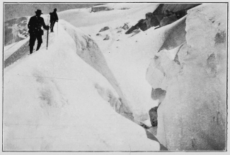 A great crevasse in the upper snow fields.

To face p. 137.