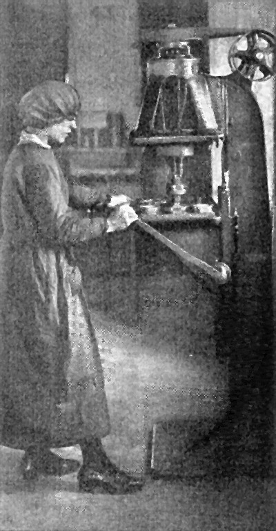 A Woman
    Operating a Multiple Spindle Drill in an English Shell Factory.