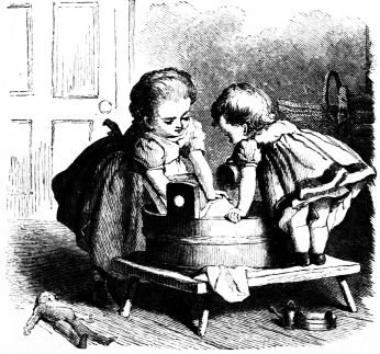 little girls washing laundry