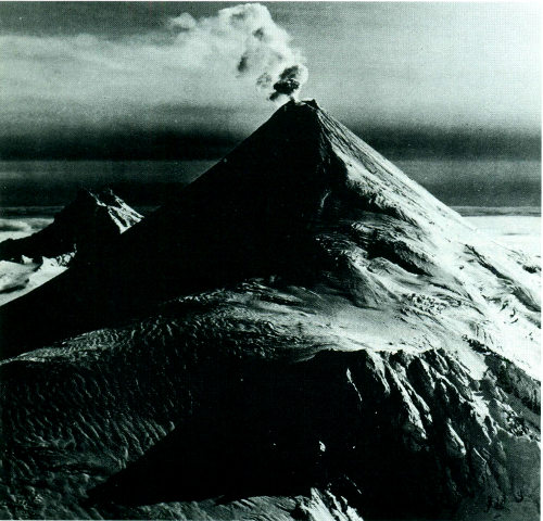 Shishaldin Volcano, an imposing composite cone, towers 9,372 feet above sea level in the Aleutian Islands, Alaska.