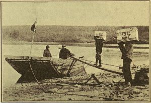 boat at shore being loaded