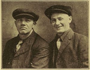 Photo of two men in newsboy caps