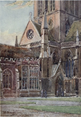 ENTRANCE TO ST. JOHN’S COLLEGE CHAPEL FROM THE FIRST
COURT

In the corner on the right is seen the Doorway of the Chapel, with the
tower rising above it. On the left is part of the Hall with a fine oriel
window.