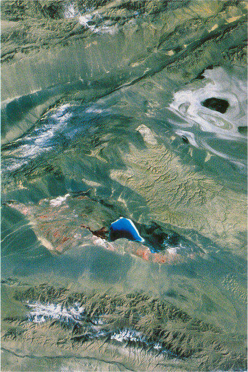 The Qaidam Depression in China is the highest desert in the world. This Landsat image illustrates a salt lake and evaporite basins in the depression.