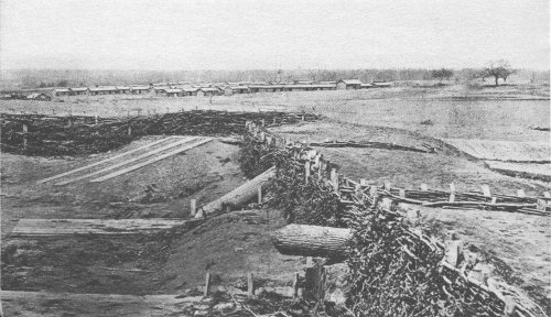 Quaker guns at Centreville. Confederate winter quarters are shown in background. Wartime photograph. Courtesy National Archives.