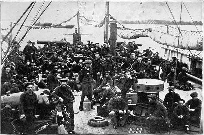 GROUP OF SAILORS ON A GUNBOAT