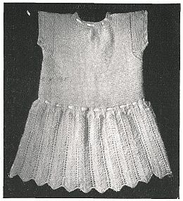 looks like little knit dress with scalloped hem and cap sleeves
