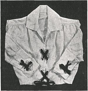 short blouse dark bows at chest, each wrist and waist