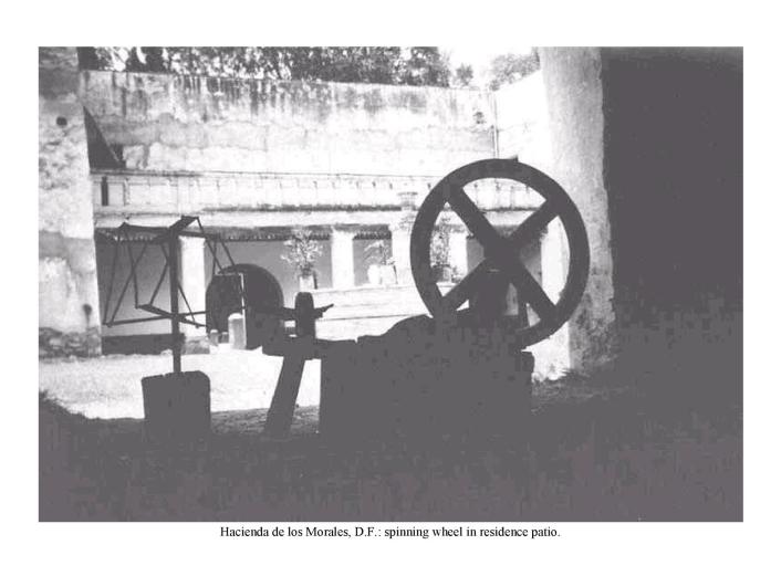 Hacienda de los Morales, D.F.: spinning wheel in residence patio.