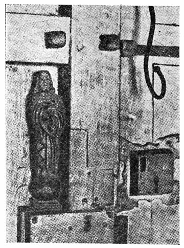 Carving of the Sacred Heart of Jesus, made by Rizal while in the Ateneo. Even then he was the hero of his schoolmates and the little image was long kept, as here shown, on the door of the students’ dormitory. In 1896 his former teachers removed it and took it to him in the death cell at Fort Santiago