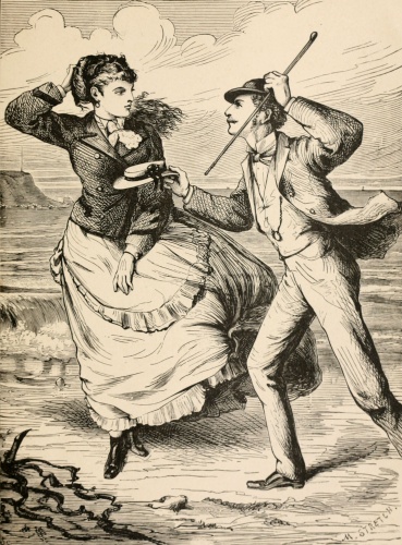 man and woman at windy seashore