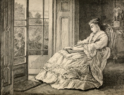 woman sleeping in chair next to window
