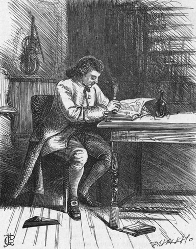 Man Sitting at a table writing.