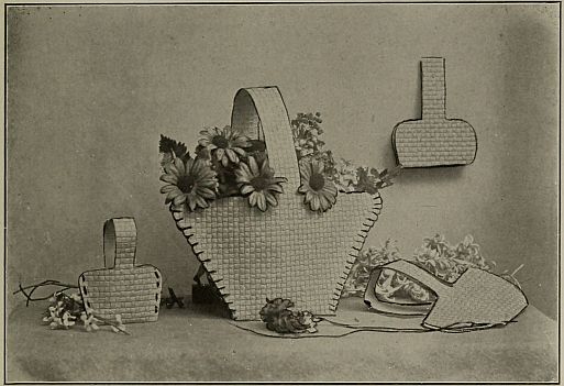 photograph of  four May baskets, some with flowers