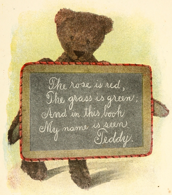 Teddy holding slate with message