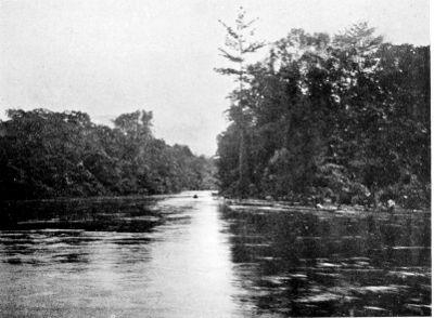 THE SAME IN FLOOD. THE VILLAGE HAS DISAPPEARED AND THE PEOPLE ARE
IN CANOES.