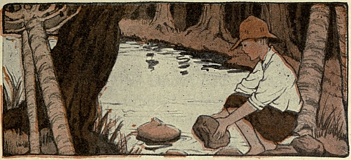 boy playing in creek