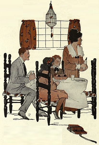 family sitting at dining table looking off to the right