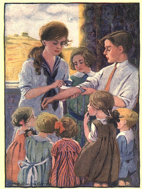 Mary Frances bandaging a  boy's arm