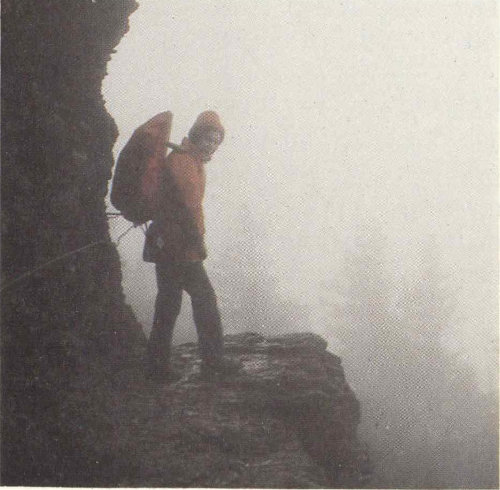 Hiker on mountain ledge
