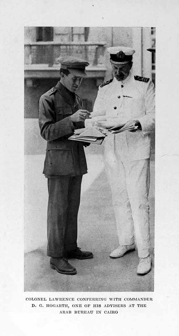Photograph: COLONEL LAWRENCE CONFERRING WITH COMMANDER
    D. G. HOGARTH, ONE OF HIS ADVISERS AT THE ARAB BUREAU IN CAIRO
