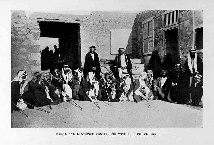 Photograph: FEISAL AND LAWRENCE CONFERRING WITH BEDOUIN SHEIKS