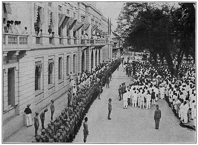 Philippine University Cadets in formation in front of the Ayuntamiento, the central government building