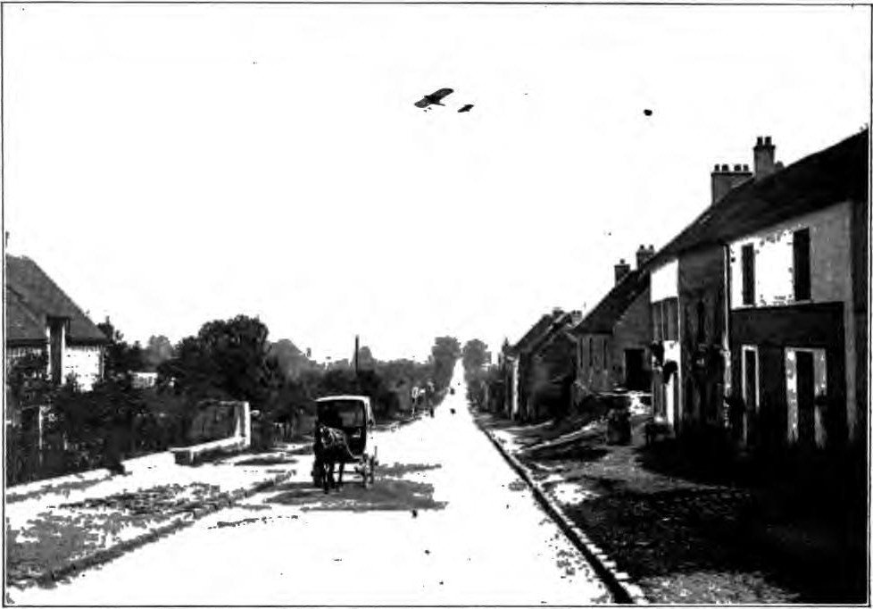 AIRSHIP CROSSING ONE OF THE NATIONAL ROADS IN RURAL FRANCE