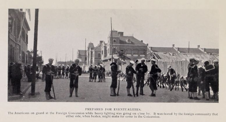 PREPARED FOR EVENTUALITIES. The Americans on guard at the Foreign Concession while heavy fighting was going on close by. It was feared by the foreign community that either side, when beaten, might make for cover in the Concession.