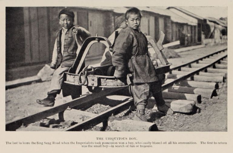 THE UBIQUITOUS BOY. The last to leave the Sing Seng Road when the Imperialists took possession was a boy, who coolly blazed off all his ammunition.  The first to return was the small boy--in search of fun or treasure.