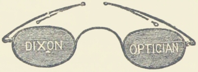 Pair of glasses with Dixon Optician on the lenses