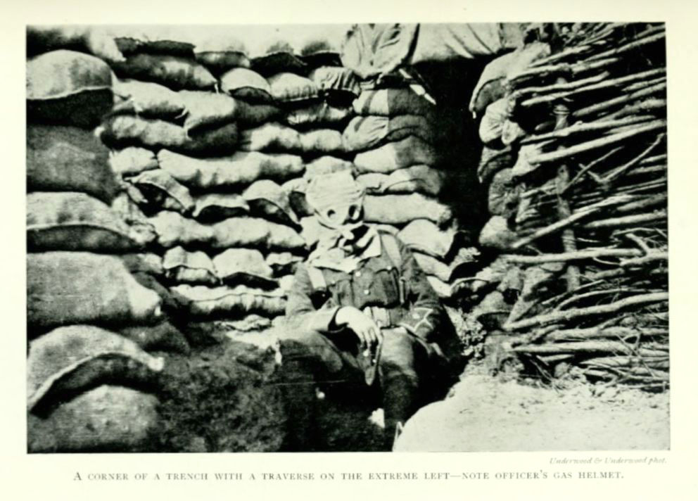 A corner of a trench with a traverse in the extreme left—note
officer’s gas helmet.