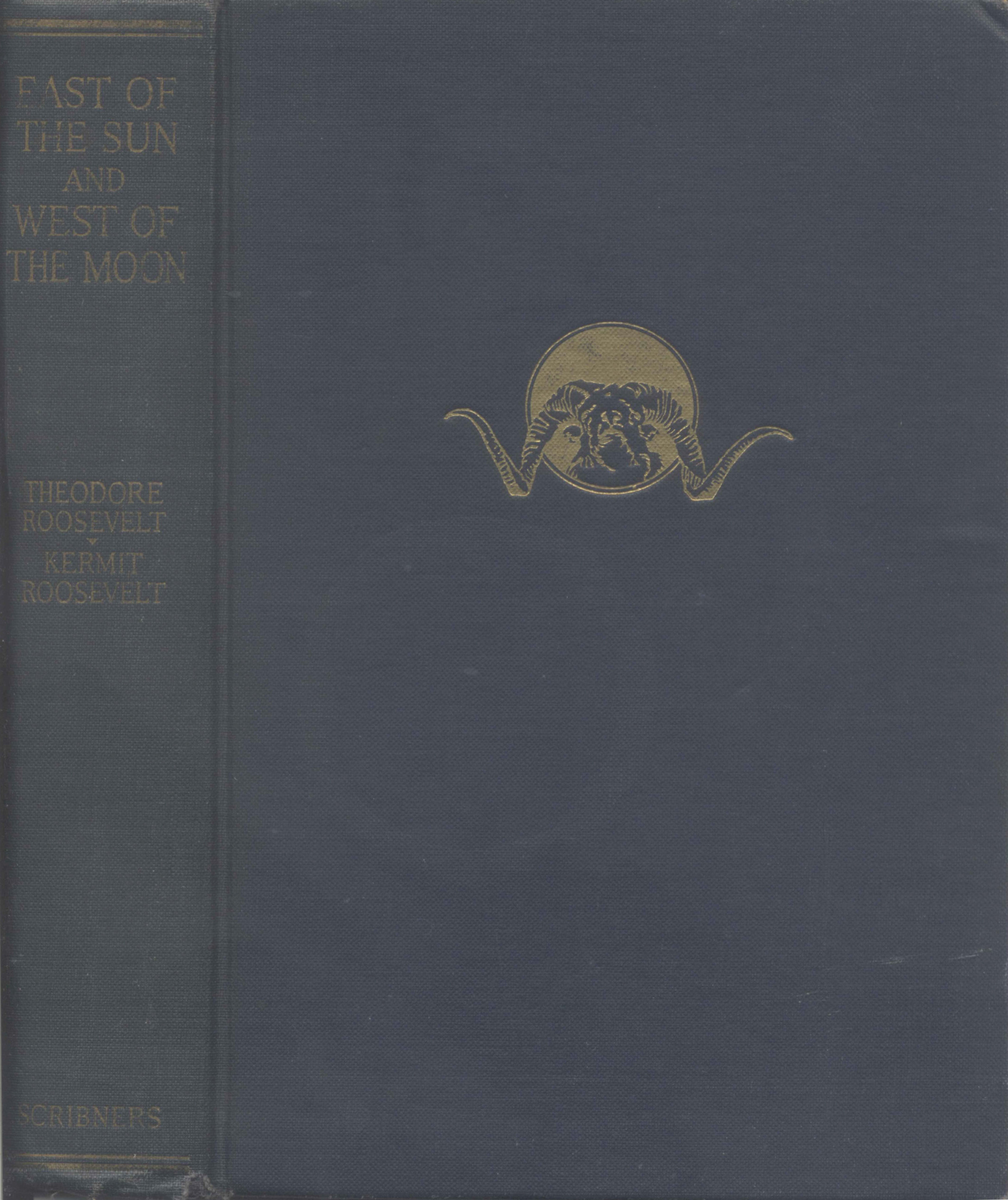 A golden bull in front of a sun on a blue background.