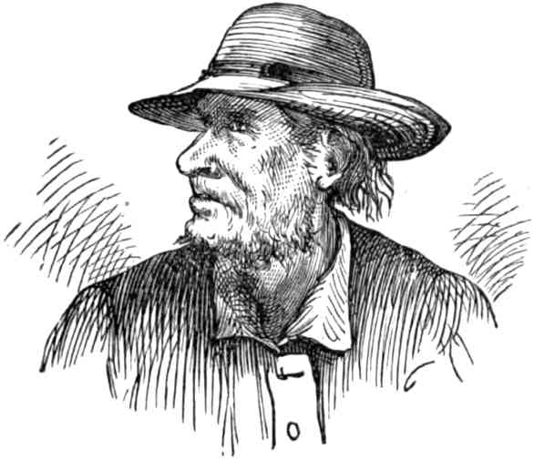 A man wearing a coat and wide-brimed hat