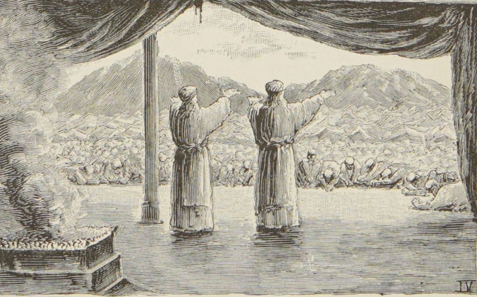 A priest blesses the crowd.